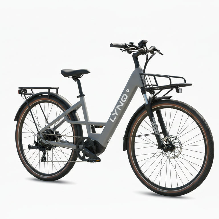 The LYNQ Current e-bike is shown in cool grey with a front cargo rack.